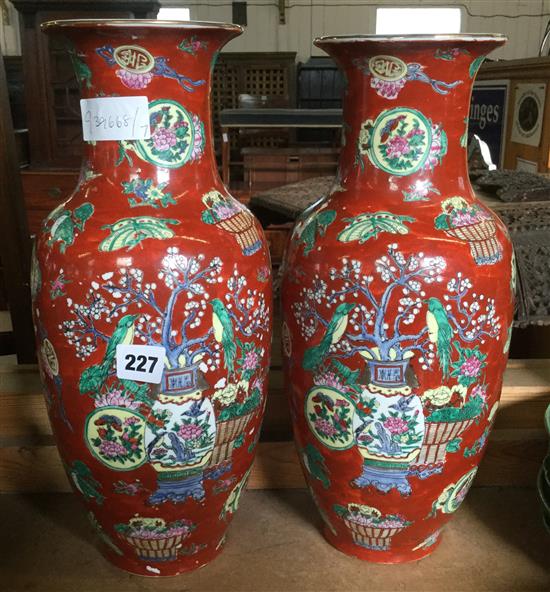 Pair red ground Oriental vases